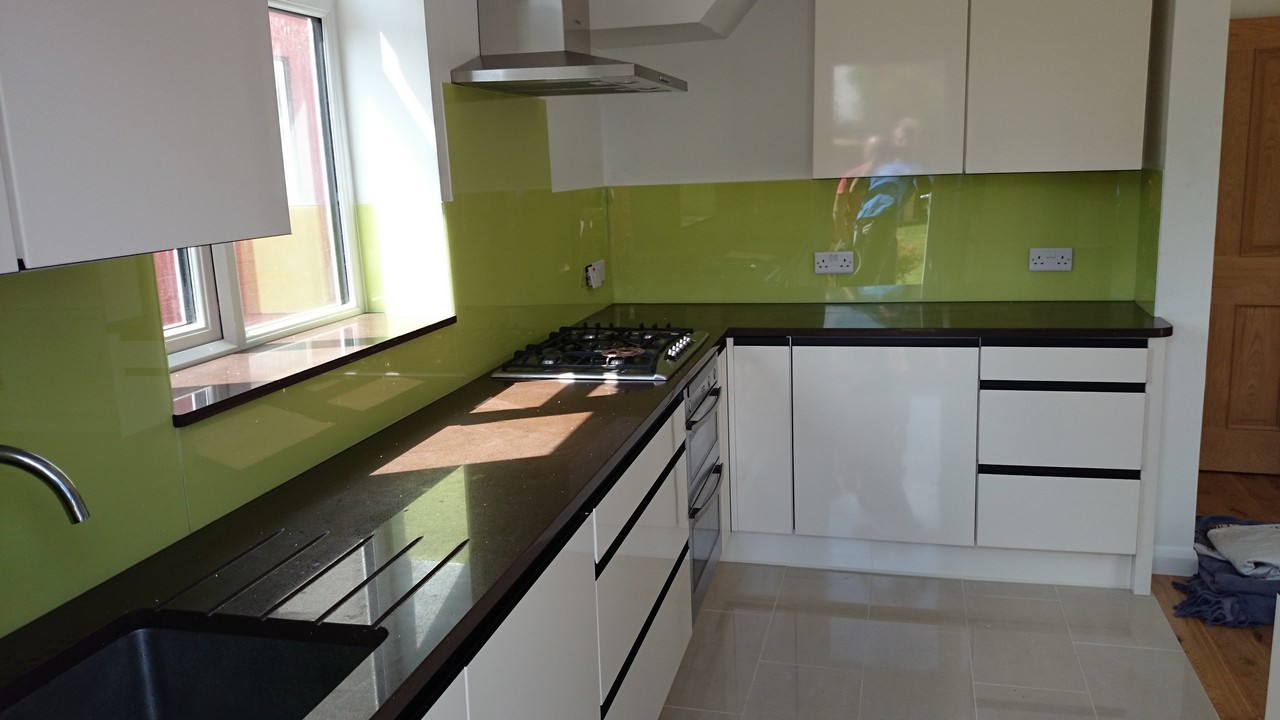 Lime green glass kitchen splashback installed by New Malden glaziers