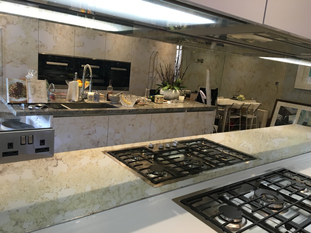 Mirror glass splashback in New Malden luxury kitchen