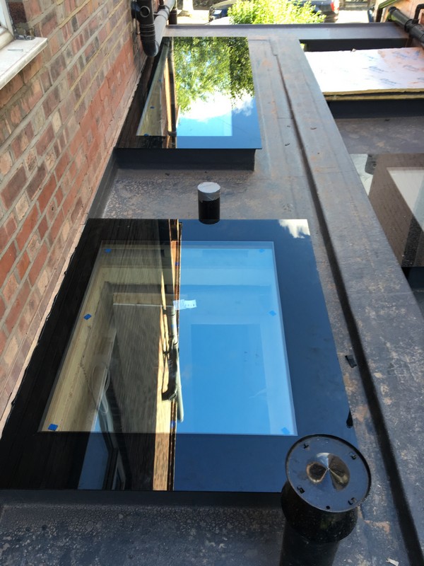 Multiple flat roof skylights on extension in New Malden