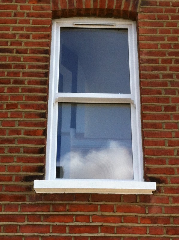 uPVC sash window on Victorian red brick house in New Malden